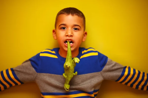 Afro American boy against yellow background — Stock Photo, Image