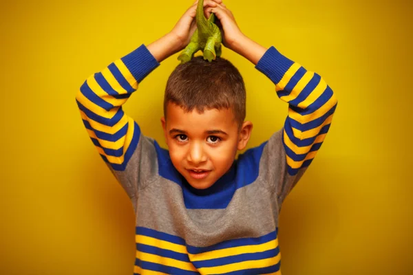 Afro American boy against yellow background — Stock Photo, Image