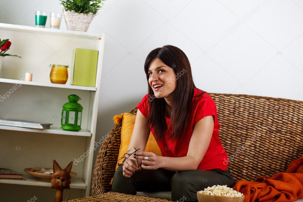 Young woman sitting on a couch