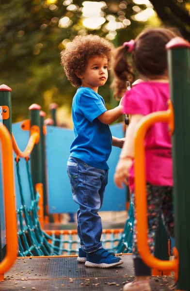 Cute mixed race boy in park — Stock Photo, Image