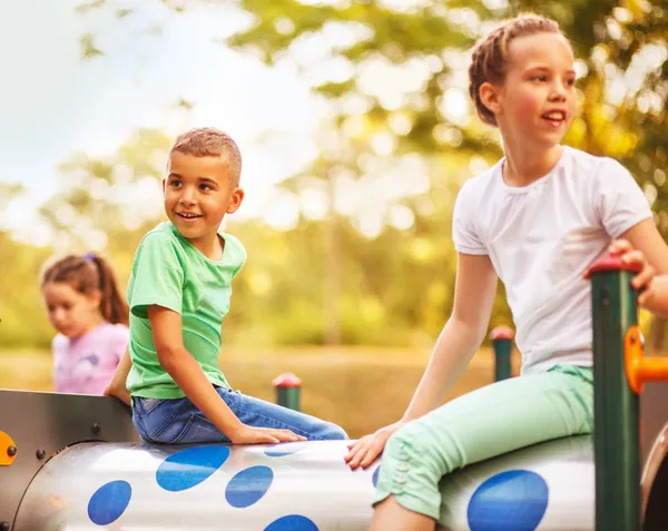 Cute mixed race kids in park — Stock Photo, Image