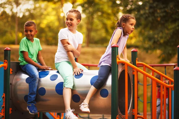 Caucasian girls and Afro American boy, on playground in kindergarten — Stock Photo, Image