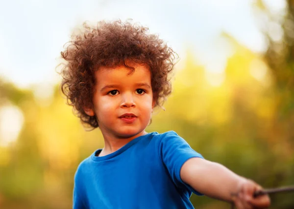 Cute mixed race boy, in park — Stock Photo, Image