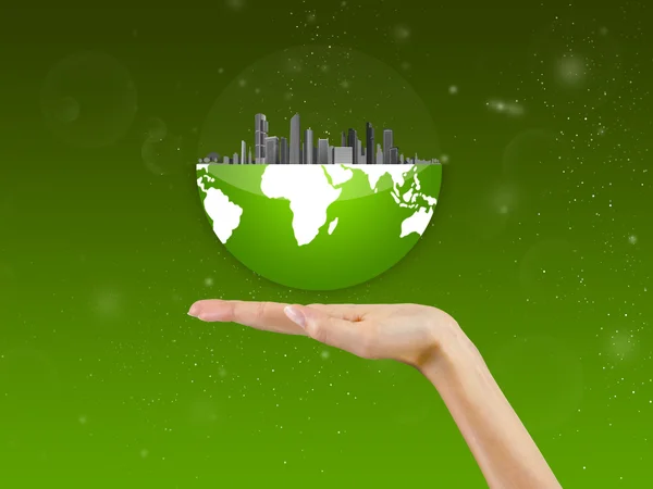 Cidade em um globo, na palma da mão, fundo — Fotografia de Stock