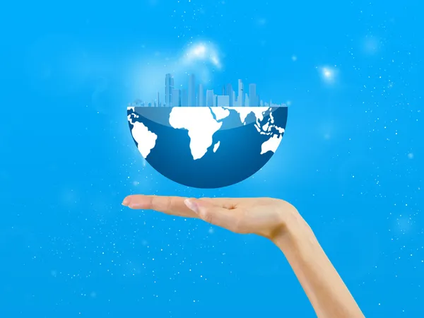 City in a globe, in the palm of hand, background — Stock Photo, Image