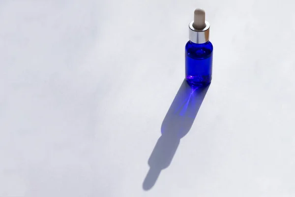 Sunlit Blue Galss Bottle Pipette Full Skin Care Serum White — Stock Photo, Image