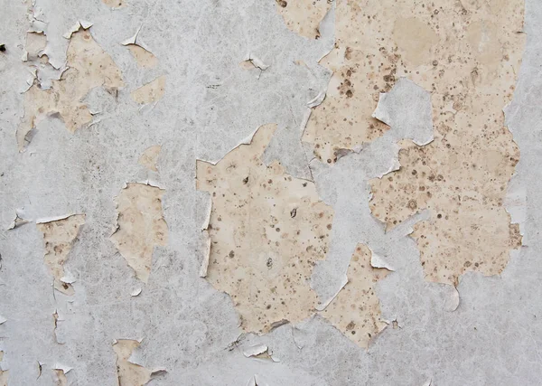 Çatlak desenli eski boyalı duvar..