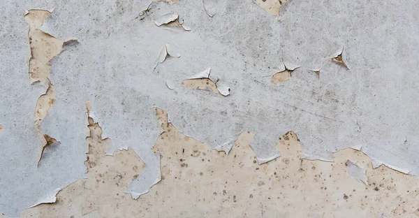 Çatlak desenli eski boyalı duvar..