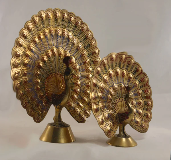 Two brass figurines of peacocks with spread tail — Stock Photo, Image