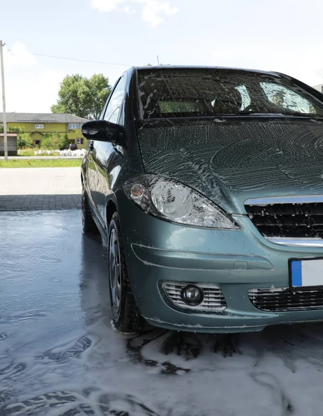 Passenger car at a car wash. High quality photo