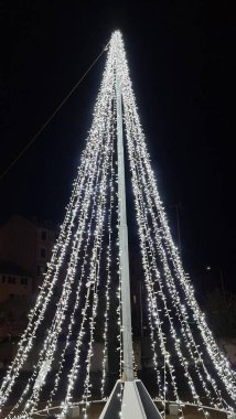 Genova, Italy - December 25, 2021: Beautiful christmas decorations around the city of Genova. Led lights through the streets. Old Architecture.