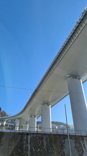 Genova, Italy- January 20, 2022: Beautiful viiew to the new bridge of Genova froom the bottom. Modern construction. Ponte San Giorgio with blue sky in the background.