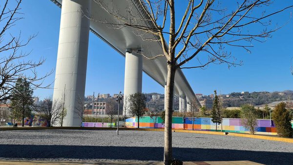 Genova, Italy- January 20, 2022: Beautiful viiew to the new bridge of Genova froom the bottom. Modern construction. Ponte San Giorgio with blue sky in the background.
