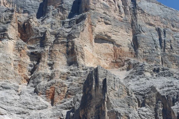 Val Badia, Italy-July 17, 2022: The italian Dolomites behind the small village of Corvara in summer days with beaitiful blue sky in the background. Green nature in the middle of the rocks.