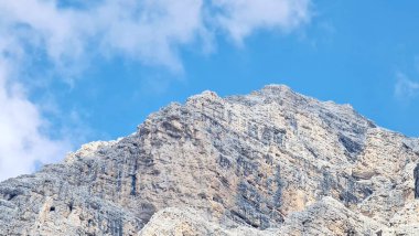 Val Badia, Italy-July 18, 2022: The italian Dolomites behind the small village of Corvara in summer days with beaitiful blue sky in the background. Green nature in the middle of the rocks.
