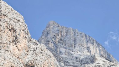 Val Badia, Italy-July 18, 2022: The italian Dolomites behind the small village of Corvara in summer days with beaitiful blue sky in the background. Green nature in the middle of the rocks.