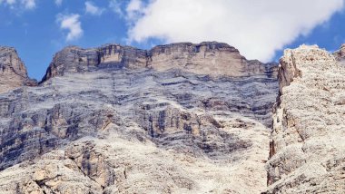 Val Badia, Italy-July 18, 2022: The italian Dolomites behind the small village of Corvara in summer days with beaitiful blue sky in the background. Green nature in the middle of the rocks.