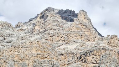 Val Badia, Italy-July 18, 2022: The italian Dolomites behind the small village of Corvara in summer days with beaitiful blue sky in the background. Green nature in the middle of the rocks.