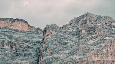 Val Badia, Italy-July 18, 2022: The italian Dolomites behind the small village of Corvara in summer days with beaitiful blue sky in the background. Green nature in the middle of the rocks.