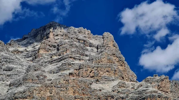 Val Badia, Italy-July 18, 2022: The italian Dolomites behind the small village of Corvara in summer days with beaitiful blue sky in the background. Green nature in the middle of the rocks.