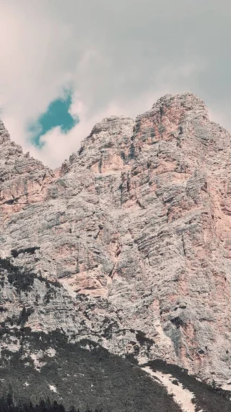 Val Badia, Italy-July 18, 2022: The italian Dolomites behind the small village of Corvara in summer days with beaitiful blue sky in the background. Green nature in the middle of the rocks.