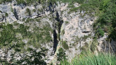 Val Badia, Italy-July 18, 2022: The italian Dolomites behind the small village of Corvara in summer days with beaitiful blue sky in the background. Green nature in the middle of the rocks.