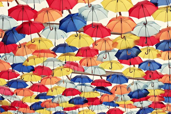 Colorful umbrellas in the sky Stock Photo