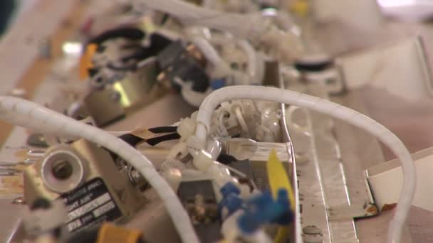 Hands of a man handling complicated wiring — Stock Video