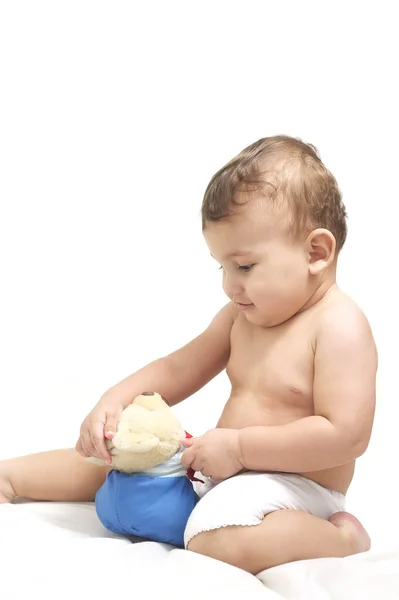 Baby gambling with his teddy — Stock Photo, Image