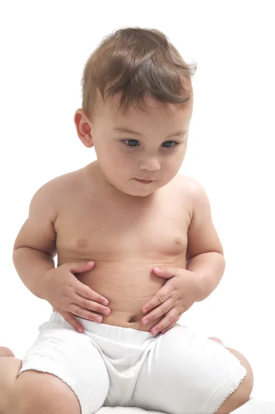 Bebê olhando em sua barriga Imagem De Stock