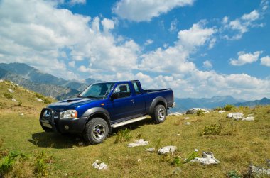 car vehicle 4x4 off road  climbing on the mountain at a car race in village theodoriana , arta perfecture , greec