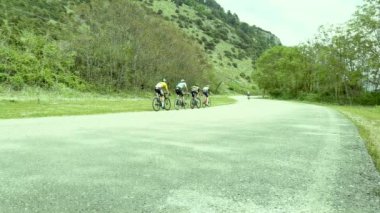 bikes bicyclist in international bike tour of greece , ioannina lake in may spring 2022
