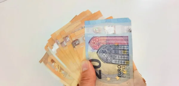 Hand Gives Money Euros Pile Banknotes White Background — Stock Photo, Image