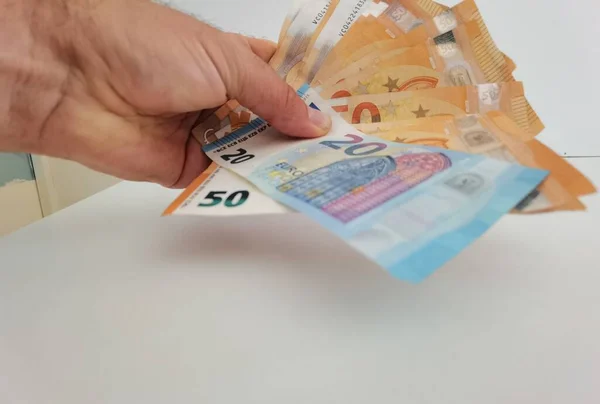 Mano Denaro Euro Pile Banconote Sfondo Bianco — Foto Stock