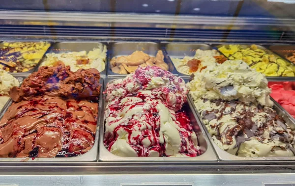 ice cream ice creams icecream flavors in frontstore of a shop in summer season in greece