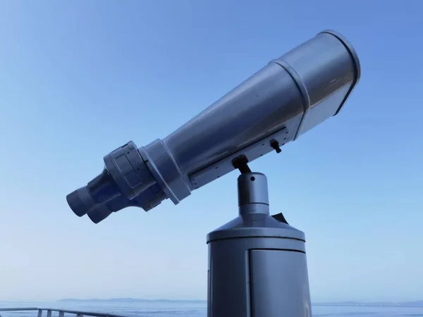 binocular isolated on the blue sky watching on the sea  from ship in greece