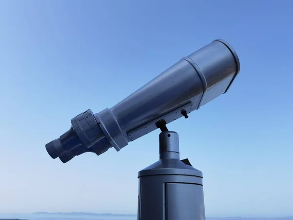 binocular isolated on the blue sky watching on the sea  from ship in greece