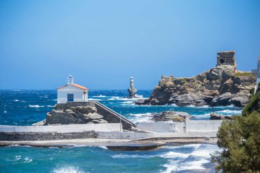 andros island greece, andros city capital of the island in windy summer day,lighthouse