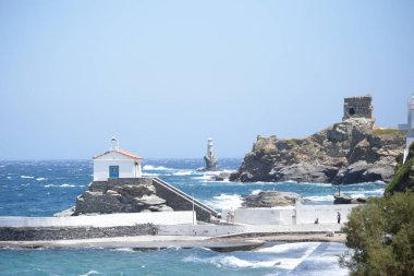 andros island greece panagia thalassini church wavy sea in windy sunny day