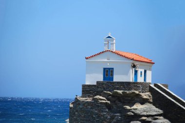 andros island greece panagia thalassini church wavy sea in windy sunny day