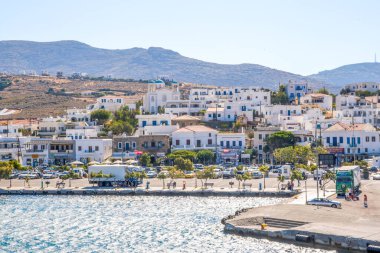 gavrio city and port in andros island greece houses ships people boarding to the ship