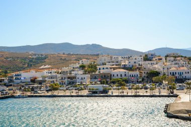 gavrio city and port in andros island greece houses ships people boarding to the ship