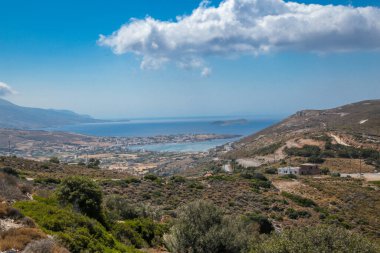gavrio city and port in andros island greece houses ships people boarding to the ship
