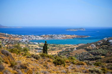 gavrio city and port in andros island greece houses ships people boarding to the ship
