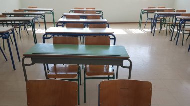 desks class chairs in secondary school empty in the morning