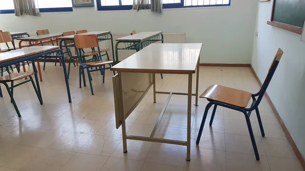 desks class chairs in secondary school empty in the morning