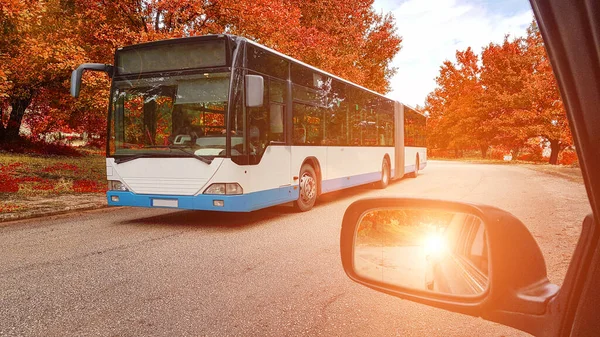 bus road street in autum car mirror nature