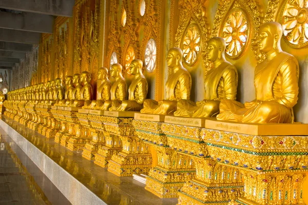 Row of golden monk buddhist statues — Stock Photo, Image