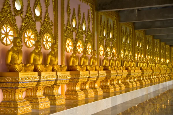 Row of golden monk buddhist statues — Stock Photo, Image