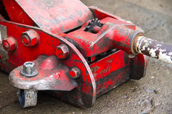 Hydraulic car jack to lift car for change the wheel. — Stock Photo, Image